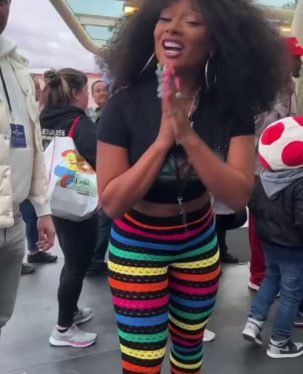 Megan Thee Stallion Rocks Rainbow Leggings While Snapping Pics With Fans at Super Nintendo World