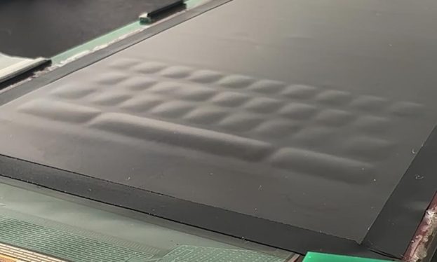 This OLED screen can fill with liquid to form tactile buttons