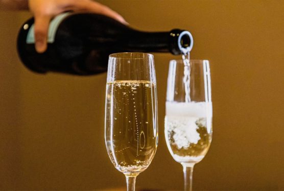 Physicists unlock secret of why champagne bubbles form straight chain as they rise