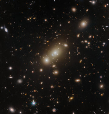 Hubble Views a Double Cluster of Glowing Galaxies