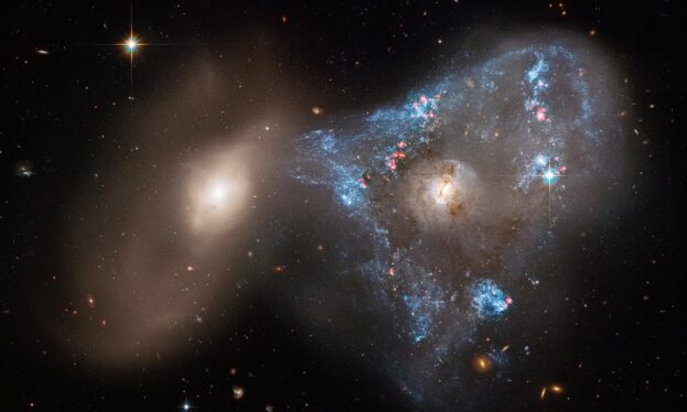 Hubble spies baby stars being born amid chaos of interacting galaxies