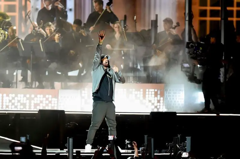 Eminem Performs Surprise ‘Sing For the Moment’ With Jelly Roll, Debuts ‘Houdini’ Live at All-Star Michigan Central Station Re-Opening